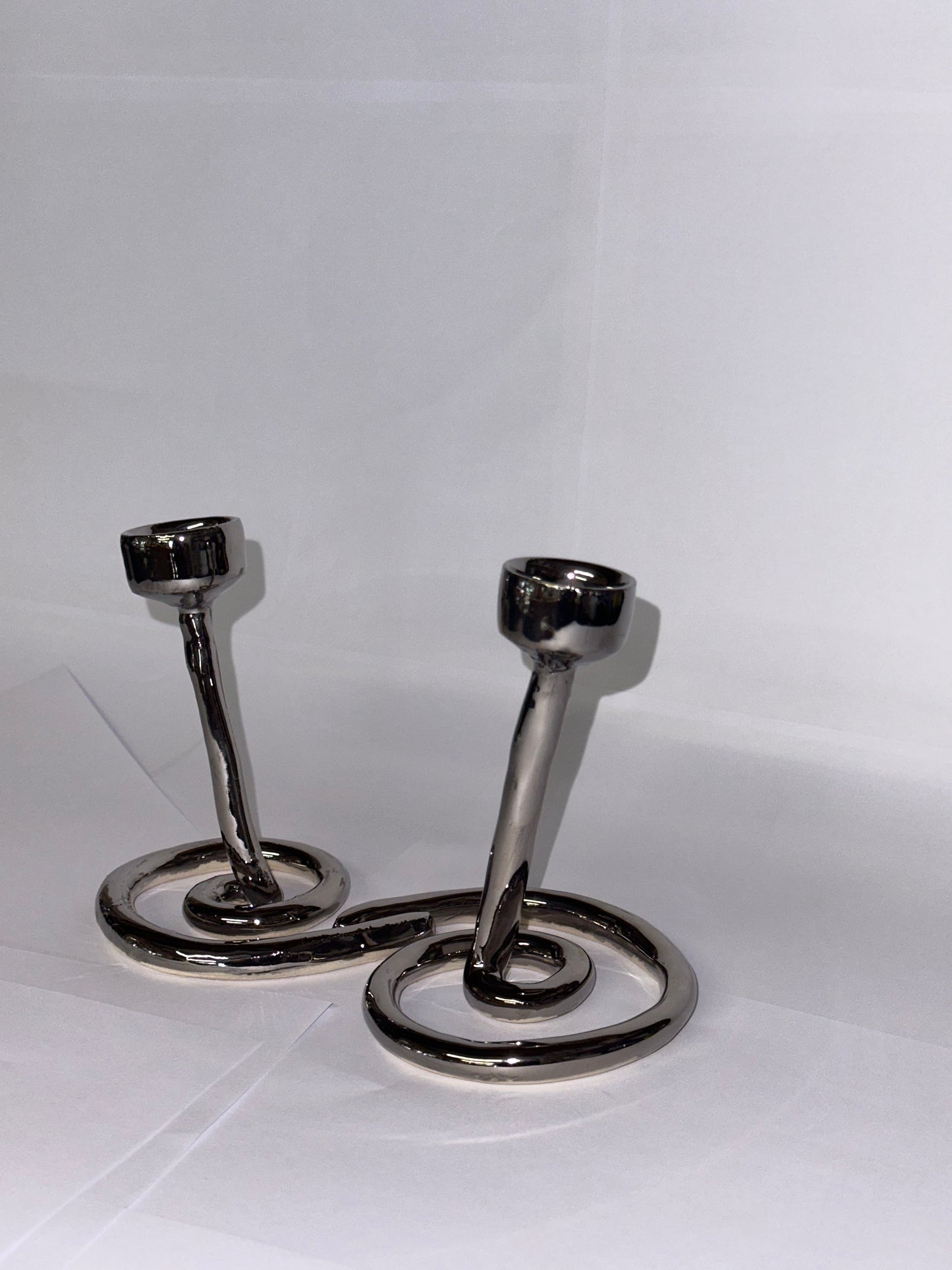 Double swirl candlestick holder