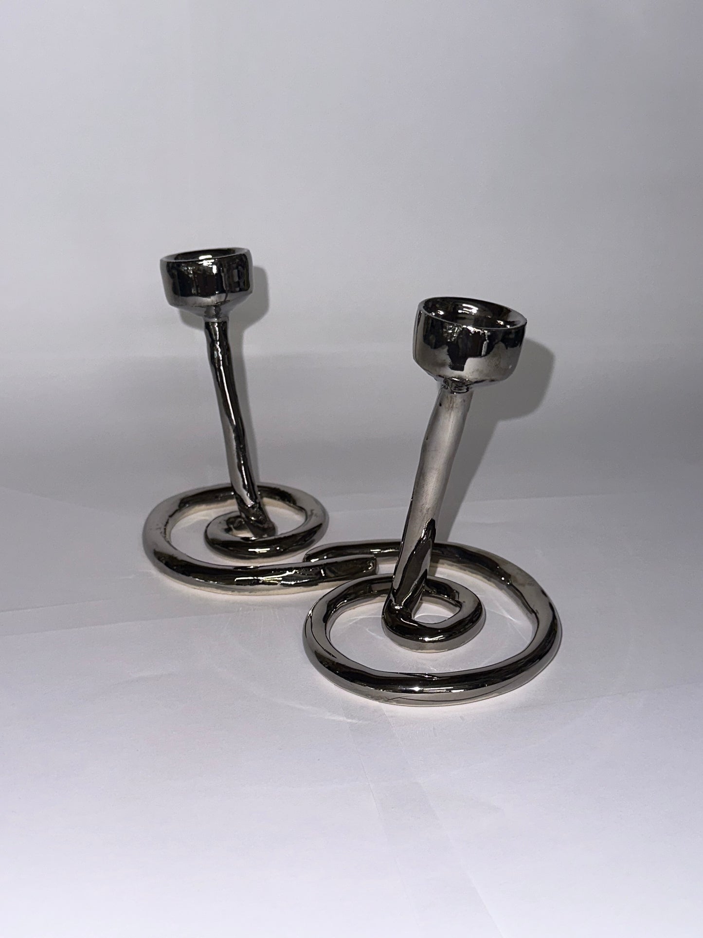 Double swirl candlestick holder