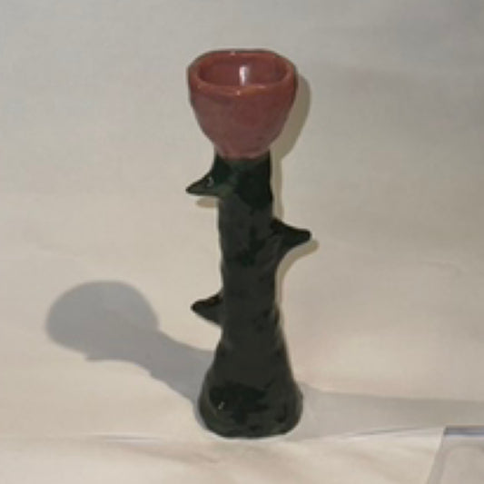 A rose between three thorns candlestick